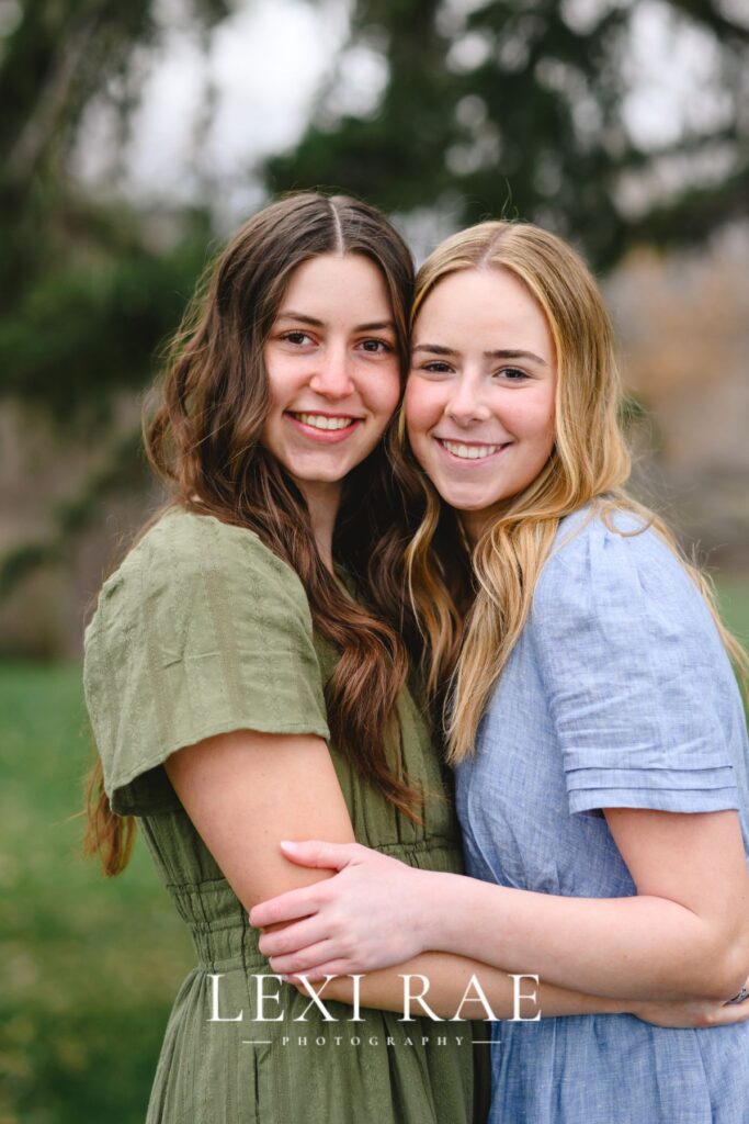 sisters posing for a professional picture together in American Fork Utah
