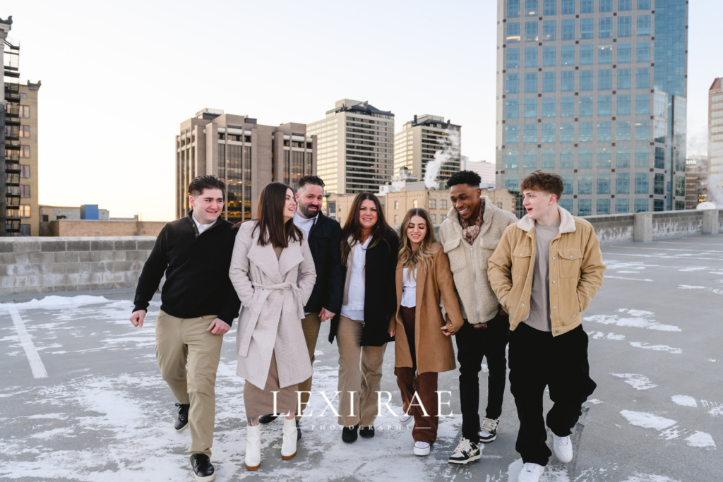 Salt Lake City, Utah family photography session. Taken on the roof of a building. Family is wearing winter coats and sweaters. 