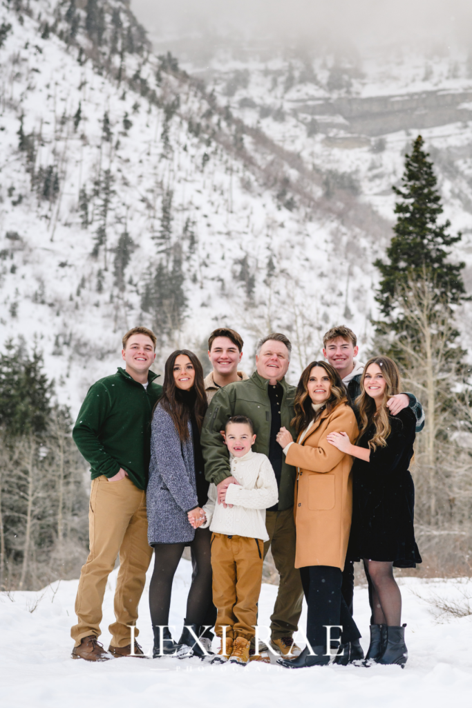 Family photography session Alpine Utah. Family wearing coats and layers in the Utah snowy mountains. 